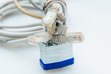 bundle of network wires blocked with metal padlock on white background