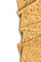 The  crispy bread with pumpkin seeds. Knackebrot on white background.