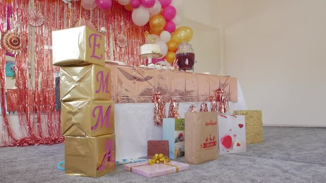 The birthday decorations air balloons cake sweets name Emma