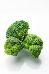 Fresh green broccoli on a white background. High quality photo