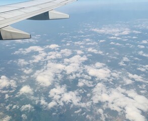 Obraz premium an airplane floating on the clouds