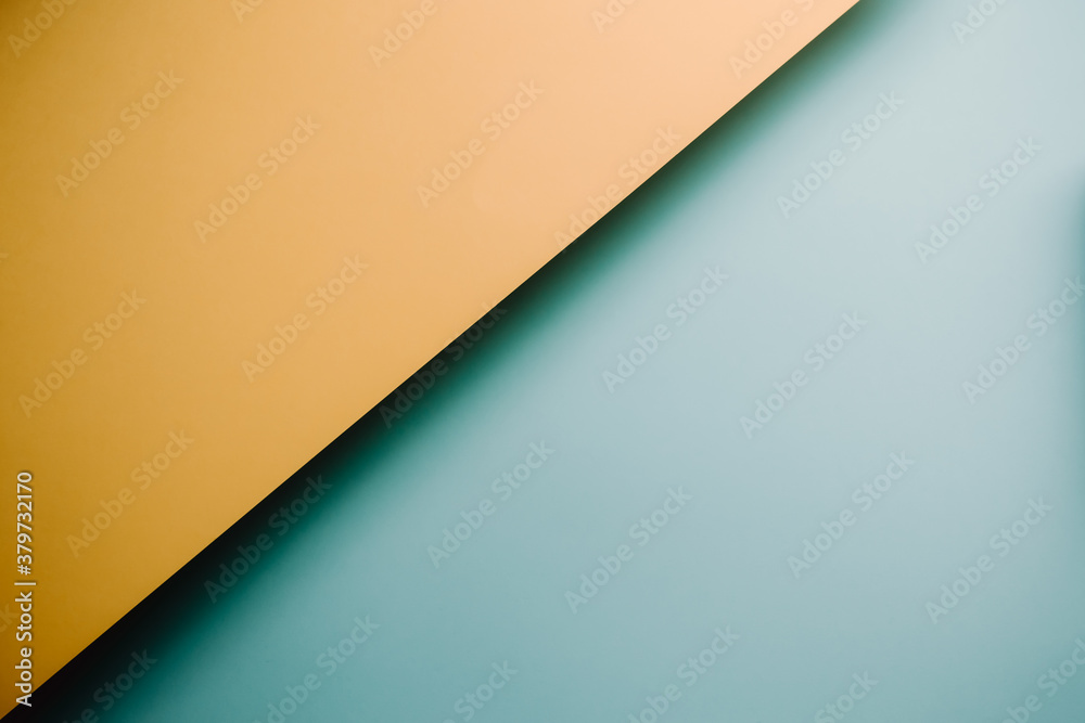 Fototapete yellow and blue pastel flat lay background with sharp layers and shadows with copy space