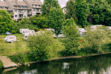 Fototapeta na wymiar River Ruhr with residential buildings and campground - Essen, NRW, Germany