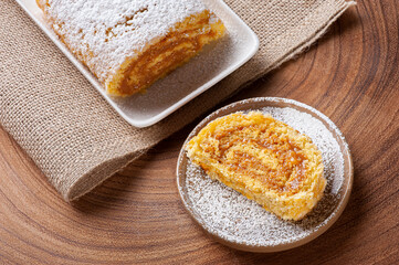 Swiss roll cake stuffed with dulce de leche. Roulade cake. Top view