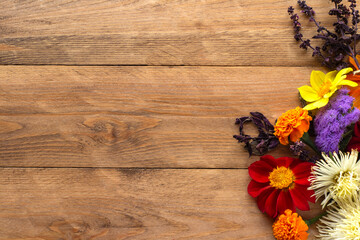 Autumn flower arrangement on the right side of the wooden background. Copyspace.