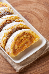 Swiss roll cake stuffed with dulce de leche. Roulade cake.