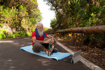 Senior man doing sport exercises