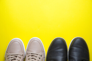 Modern Beige and Brown Leather Shoes on Yellow Background Viewed from Above