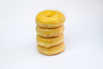 Four Classic Donuts Stack on White Background