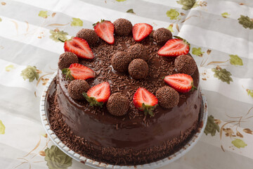 chocolate cake on a plate with strawberry