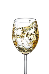 Splashes of white sparkling wine in a glass on a white isolated background.