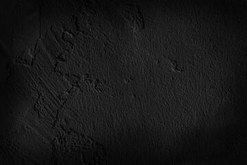 Beautiful black cement wall plastered surface background and texture pattern. Blank concrete dark rough wall for background.