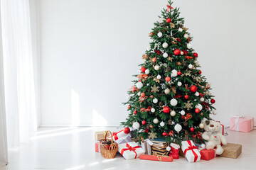 Christmas tree pine with gifts of garland lights for the new year in the interior of the room as a white background