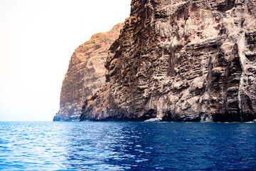 Cliffs of Los Gigantes, in Tenerife, going deeply into the blue ocean, transmits the power and...
