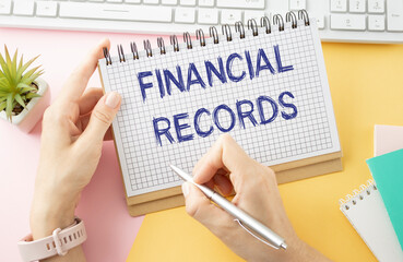 Paper with text Financial Records on a financial tables