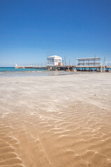 beautiful beach with lifeguard hut on sunny day/Empty sandy beach. Deserted beautiful beach with lifeguard hut
