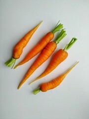 freshly picked from the vegetable garden young orange farm carrots isolated on white background. 