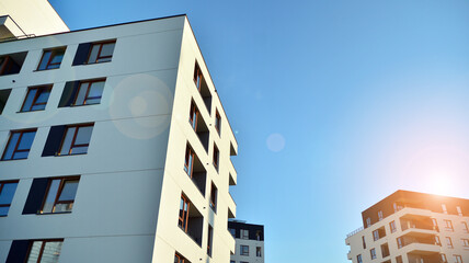 Architectural details of modern apartment building. Modern european residential apartment building complex. Sunset.
