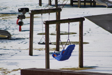 empty playgrounds in the dead of winter