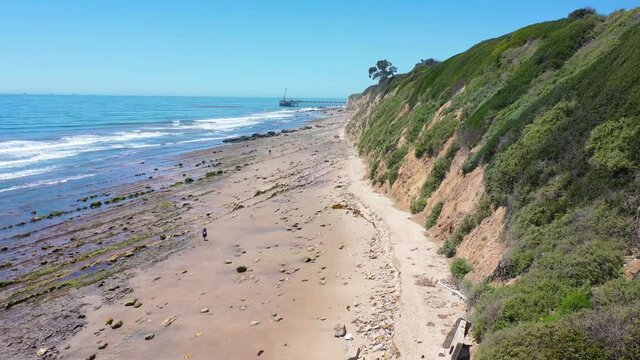 Aerial over people enjoying the beautiful coastline of Santa Barbara, California near Carpinteria bluffs.