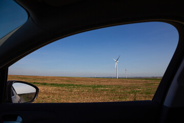 wind turbine seen from inside of the car