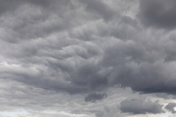 Fototapeta premium Terrible thunderclouds. Background image in a dark gray style.