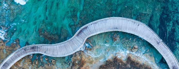 An aerial view of a walking path at Ayia Napa Cyprus during an amazing sunset
