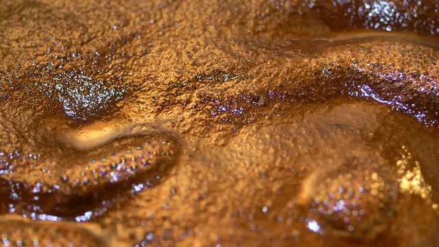 Turkish coffee simmering in extreme close up