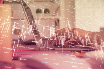 Double exposure of woman hands typing on computer and forex chart hologram drawing. Stock market invest concept.