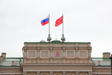 Fototapeta na wymiar The Russia Flag, beside the Flag of Saint Petersburg, Russia