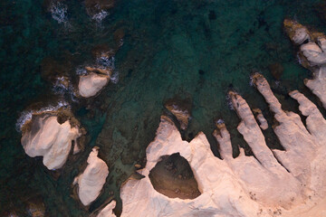 an aerial view of white rock formations on the seafront coastline of Limassol in Cyprus