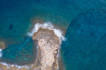 an aerial view of white rock formations on the seafront coastline of Limassol in Cyprus
