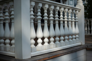 Balusters in the decoration of the veranda railings. 
