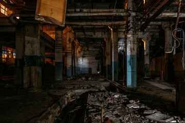 Fototapeta na wymiar Dark creepy empty abandoned industrial building interior at night