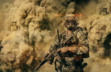 Military soldier with gas mask between smoke and dust in the battlefield.