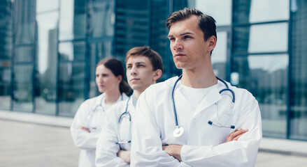 close up. team of doctors standing on a city street.
