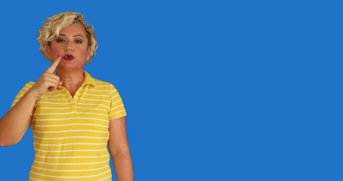 A deaf woman shows the sign language at chroma key background