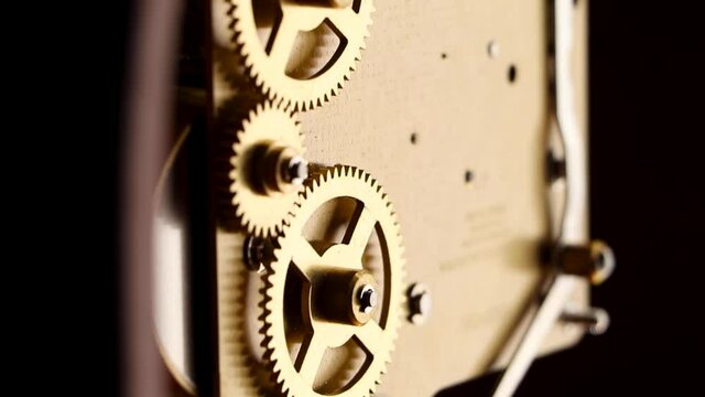 Move up cogs inside clock. Macro technology gears.