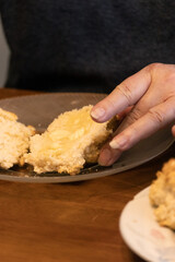 Elderly woman preparing baked and enjoying goods