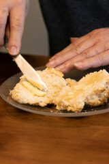 Elderly woman preparing baked and enjoying goods