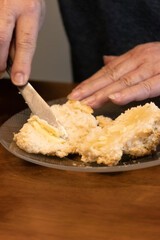 Elderly woman preparing baked and enjoying goods