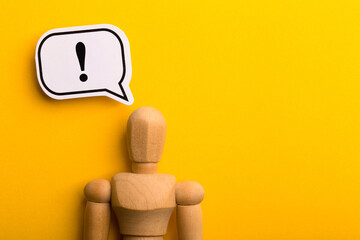 Wooden Man With Exclamation Mark Speech Bubble