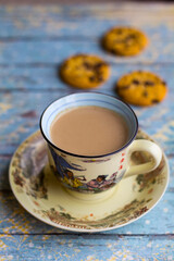 Hot milk coffee with abstract background and cookies