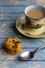 Hot milk coffee with abstract background and cookies