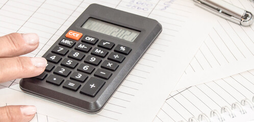 Market analysis and financial reporting using a calculator, business concept