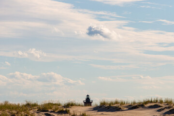 top of lighthouse behind sand dune