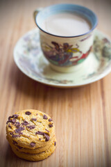 Hot milk coffee with abstract background and cookies