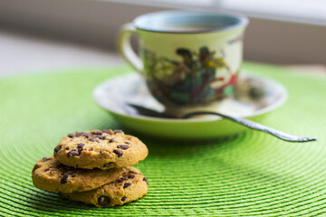 Hot milk coffee with abstract background and cookies