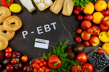 Delicious ripe fruits with vegetables on black background.