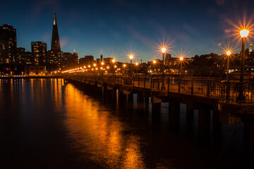 Fototapeta premium Evening Light on Pier 7 With The City Skyline In The Distance, San Francisco, California , USA